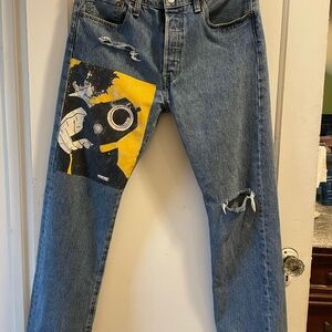 Blue Distressed Men's Jeans with Graphic Patch